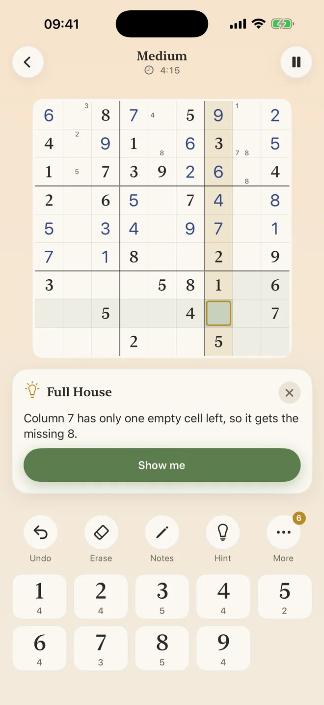A hint in the app explains the next step and highlights the pattern on the board